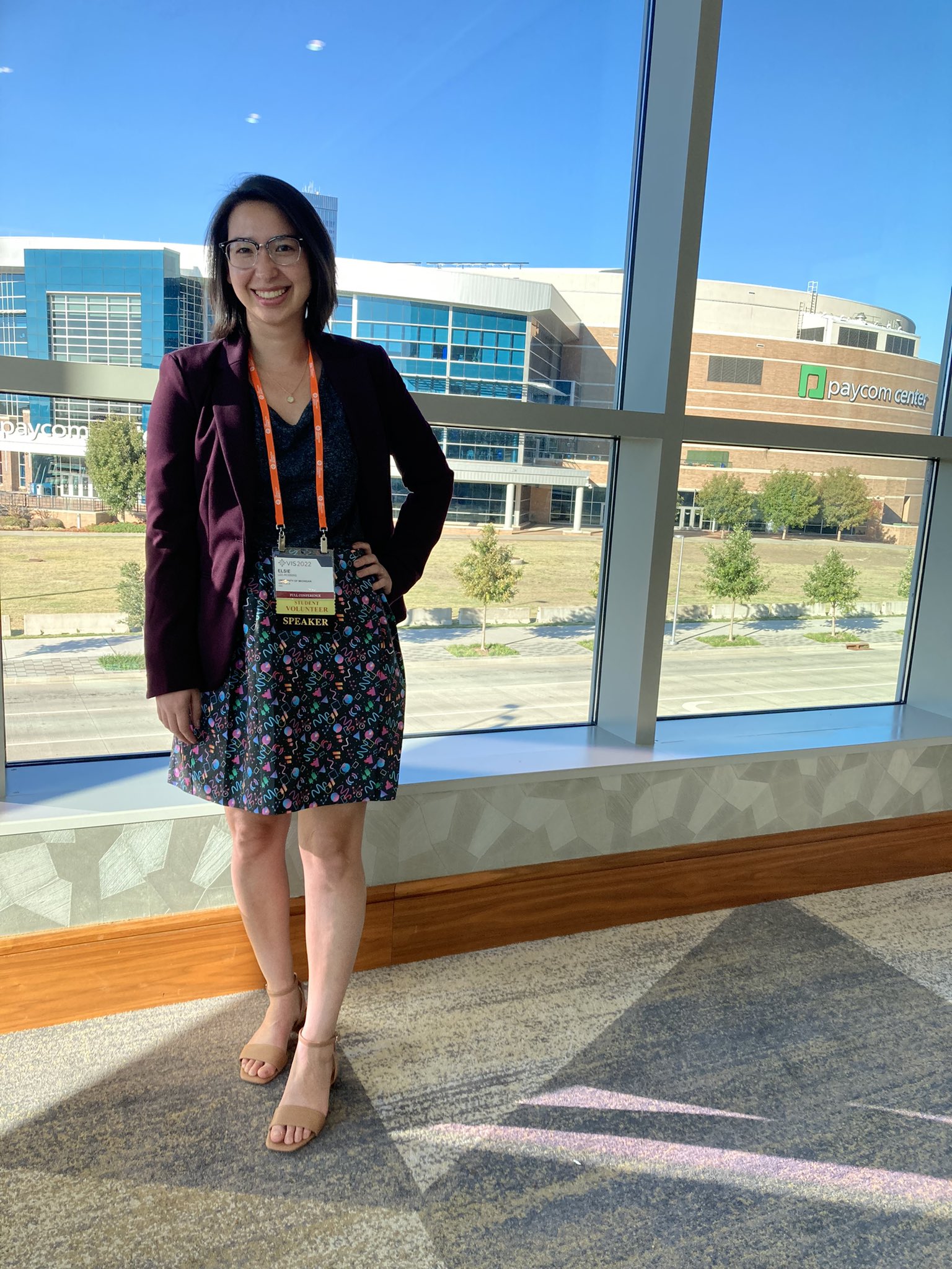 Elsie posing in a data visualization patterned skirt